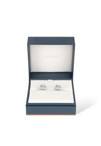 Silver cufflinks in a twisted design displayed in a dark blue box lined with cream-colored fabric, labeled "DAVIDOFF."