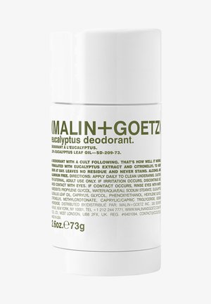 Eucalyptus deodorant in a white cylindrical tube with a green label featuring text. 2.6 oz / 73 g size indicated at the bottom.