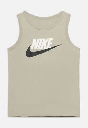 Débardeur Nike beige clair sans manches avec texte Nike blanc et logo swoosh noir sur le devant.