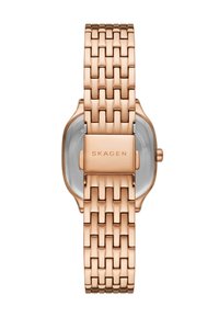 Roséguld-tonad metallklocka med en vävd armbanddesign, med en rektangulär urtavla och en minimalistisk rund urtavla. Varumärkesnamn präglat på spännet.