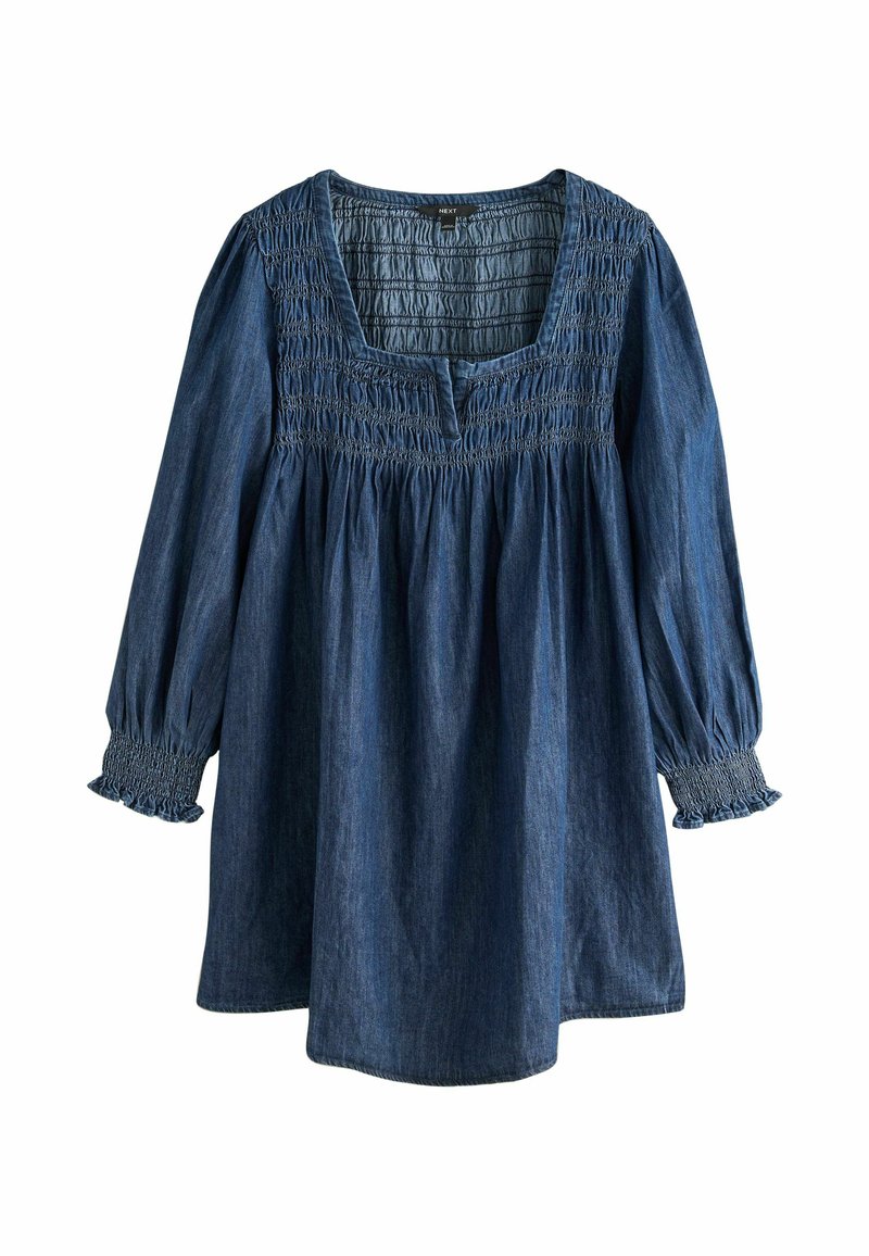 Denim tunika s kvadratnim izrezom, nabranim smokom na prsima i dugim puhastim rukavima s elastičnim manžetama. Tamnoplava tkanina.