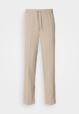 Pantalons beiges, coupe décontractée, fabriqués en tissu doux, dotés d'une taille élastique avec cordon de serrage et de jambes droites avec des accents minimalistes.