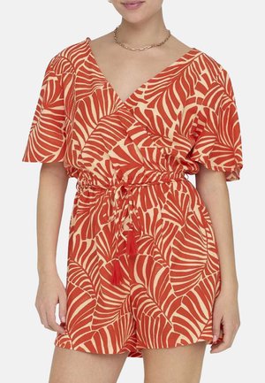 Rompers court rouge et crème avec un motif de feuilles, décolleté en V, manches courtes, taille à cordon et accents en franges. Fabriqué en tissu léger.