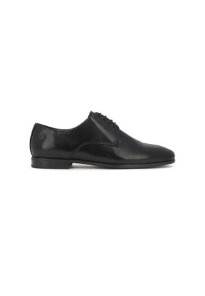 Black leather men's dress shoe with lace-up front and low heel, shown from the inner side on a white background.