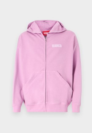 Light pink zip-up hoodie with front pockets, long sleeves, hood, and small white logo on the chest against a light grey background.