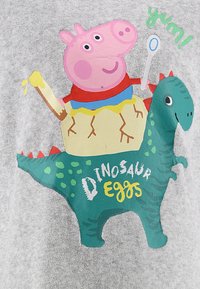 Gray fabric featuring a colorful graphic of a pink pig and green dinosaur, with text "Dinosaur Eggs," playful design elements included.