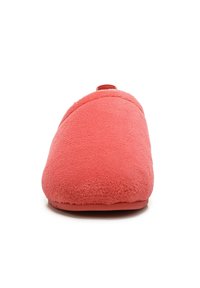 Coral fleece slipper with a rounded shape and smooth texture, featuring a subtle seam design and a looped strap at the back.