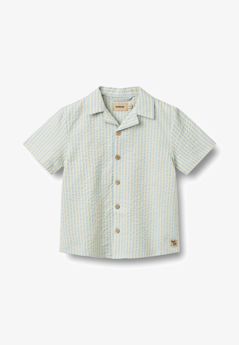 Chemise à manches courtes, boutonnée, de couleur bleu clair avec des rayures blanches verticales. Comprend des boutons en bois et un petit patch logo sur l'ourlet.
