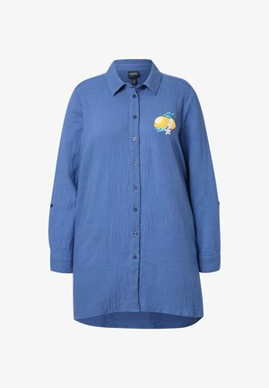 Blå skjorte med knapper lavet af struktureret stof. Har en citron- og blomsterbroderi på brystet og har en afslappet, overdreven pasform.