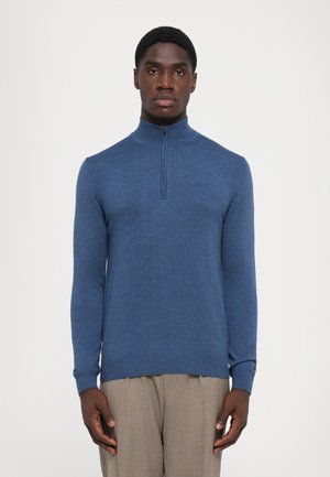 Blue zip-neck sweater made of textured knit material, featuring long sleeves and ribbed trim at hem and cuffs.