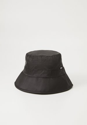 Black bucket hat made of ripstop fabric. Features a wide brim, two horizontal seams, and a small logo tag on the side. Smooth texture.