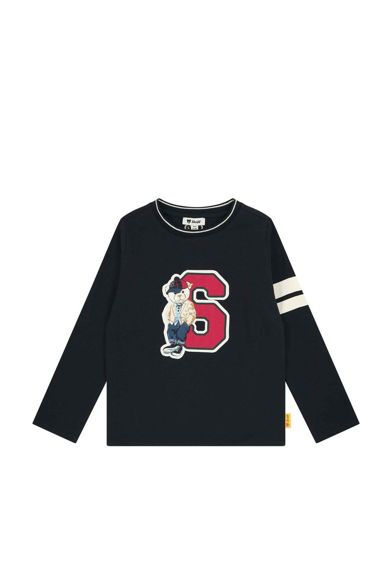 Schwarzes Langarm-T-Shirt mit Rundhalsausschnitt, das ein farbenfrohes gesticktes Bärenmotiv und die auffällige rote Nummer 6 auf der Vorderseite zeigt. Weiße Schulterstreifen.