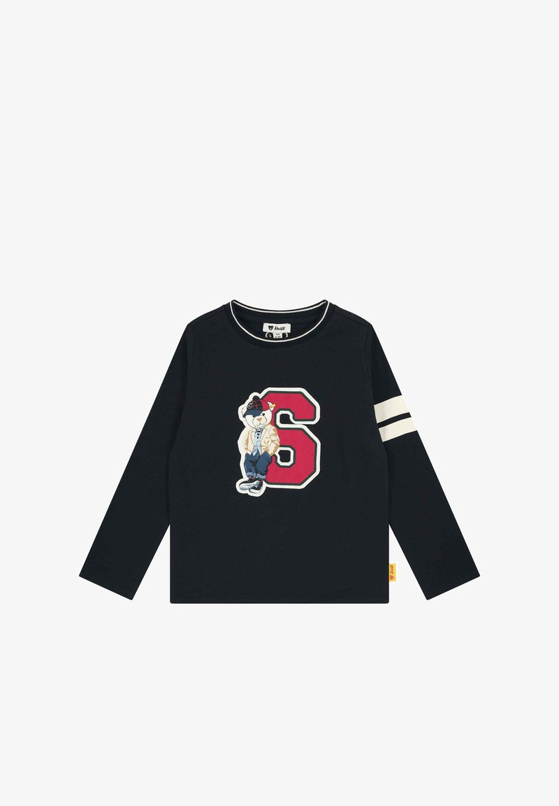 Schwarzes Langarm-T-Shirt mit Rundhalsausschnitt, das ein farbenfrohes gesticktes Bärenmotiv und die auffällige rote Nummer 6 auf der Vorderseite zeigt. Weiße Schulterstreifen.