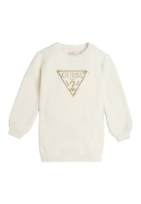 Maglione in fleece color crema con maniche lunghe, caratterizzato da un logo a triangolo dorato con "GUESS" e borchie decorative. Collo e polsini a coste.
