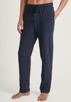 Marineblaue, weiche Baumwoll-Jogginghosen mit einem elastischen Bund, verstellbarem Kordelzug und Seitentaschen; gerades Bein Design.