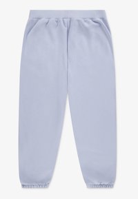 Jasnoniebieskie dresy wykonane z miękkiej bawełny. Mają elastyczny pas i mankiety oraz luźny krój, a ich powierzchnia jest gładka.