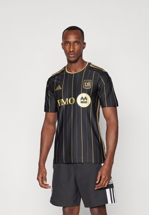 Maillot de football noir avec des rayures verticales dorées, logo BMO au centre et badge de Los Angeles FC sur la poitrine. Equipé de manches courtes.