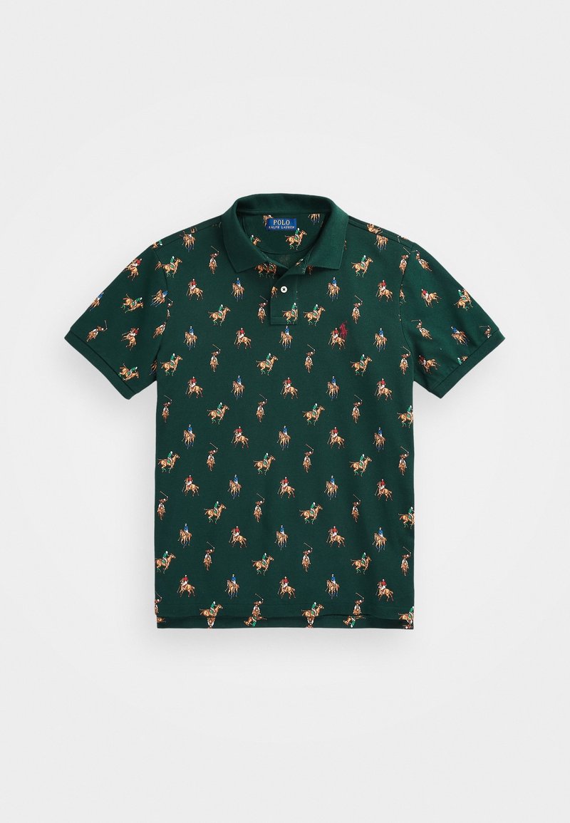 Green polo shirt featuring a repeated print of horseback riders in various colors. Classic collar, short sleeves, and soft cotton fabric.