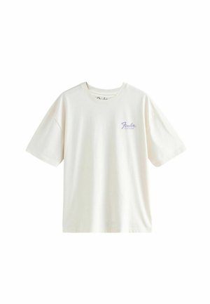 Cremfarvet bomulds T-shirt med afslappet pasform, korteærmer og et lilla "Fender" logo på venstre bryst.