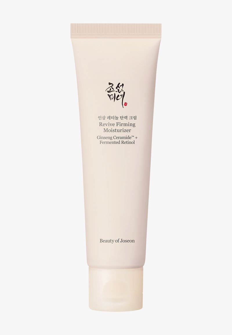 Tube de Revive Firming Moisturizer avec céramide de ginseng et rétinol fermenté par Beauty of Joseon, emballage beige clair avec texte en coréen et en anglais.