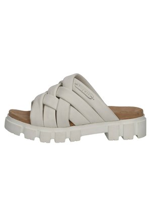 Closed-toe slide sandal with a woven design in light beige, featuring a thick rubber sole with ridges and a textured footbed.
