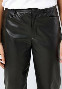 Noisy May Calças de couro - schwarz