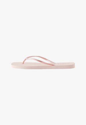 Light pink flat flip-flop sandal with thin rubber straps and a textured sole shown from the side on a white background.