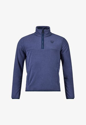 Pullover in pile blu navy con colletto alto, zip a metà sul davanti e logo sul petto. Tessuto morbido, design aderente e tasche laterali.