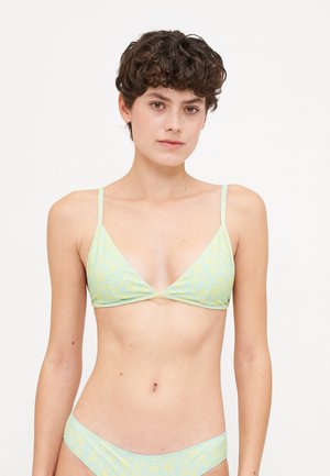 Bikini set in pastel yellow with floral pattern. Top features a triangular shape with thin straps. Bottom has a simple cut with matching design.