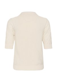 Pull en maille couleur crème à manches courtes avec motif losange texturé sur les manches, col, poignets et ourlet côtelés.