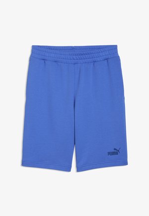 Shorts Puma bleus jusqu'aux genoux avec une ceinture élastique et un petit logo Puma noir sur la partie inférieure de la jambe gauche.