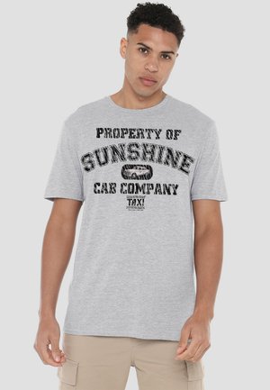 Gray cotton t-shirt featuring black graphic print stating "PROPERTY OF SUNSHINE CAB COMPANY TAXI" with a vehicle illustration in the center.