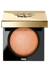 Bobbi Brown highlighter in een zwarte compacte. Beschikt over een gemarmerd champagnekleurig poeder, afgewerkt met een gouden deksel met het logo erin gedrukt.