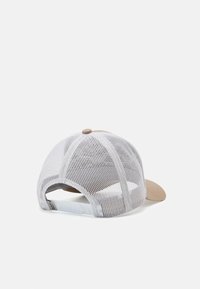 Adjustable cap with a beige front and white mesh back, featuring a rounded peak and a plastic strap closure at the rear.