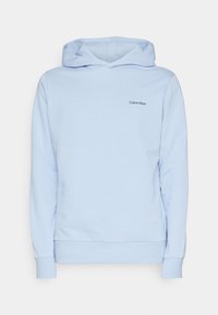 Felpa in cotone azzurro chiaro con tasca a marsupio frontale, polsini a costine e un piccolo logo nero "Calvin Klein" sul petto.