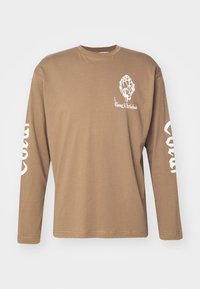 Long-sleeve brown t-shirt made of cotton, featuring a white artichoke graphic on the chest and text down the sleeves in white.