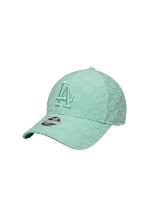Light mint green baseball cap featuring floral texture, raised embroidered logo, and a curved visor. Includes size sticker on the brim.