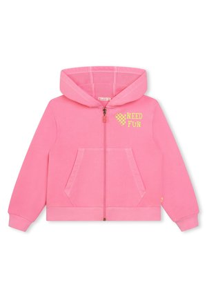 Veste à zip rose en tissu doux, dotée d'une poche avant, de poignets côtelés, et portant le texte "NEED FUN" en jaune fluo.