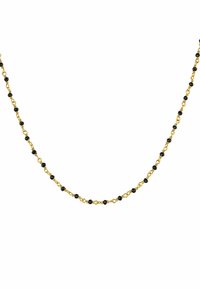 Collar de cadena de oro con cuentas negras pequeñas alternando. Textura suave, diseño delicado y espaciamiento uniforme entre los eslabones.