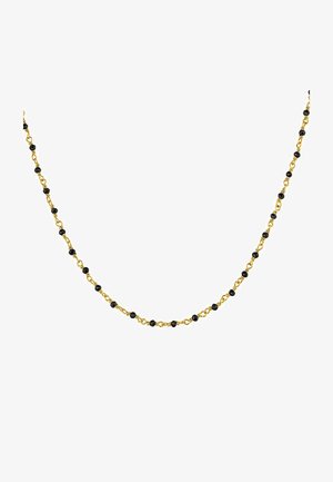 Collar de cadena de oro con cuentas negras pequeñas alternando. Textura suave, diseño delicado y espaciamiento uniforme entre los eslabones.