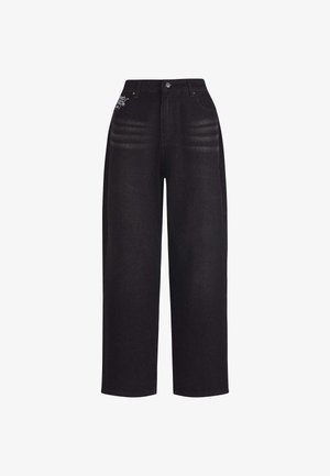 High-waist black wide-leg jeans with subtle whisker fades and a small white graphic near front right pocket, button and zip closure.