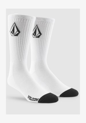 White cotton socks with ribbed texture, black toe caps, and a black logo diamond design on the sides.