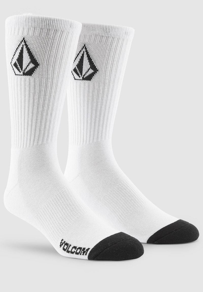 Weiße Baumwollsocken mit gerippter Textur, schwarzen Zehenkappen und einem schwarzen Logo-Diamantdesign an den Seiten.
