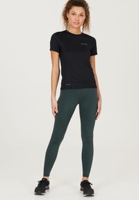 Endurance FRANZA ATMUNGSAKTIVE FUNKTIONS - Leggings - light spruce