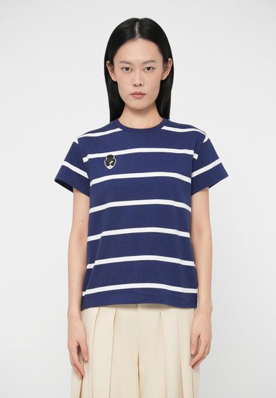 Navy blue striped t-shirt with white stripes, short sleeves, and a round neckline. Features an embroidered accent on the chest.