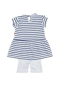 Robe rayée avec une jupe évasée, couleurs bleu marine et blanche, fermeture à boutons au dos, associée à des leggings blancs à motifs d'étoiles. Matière en coton.