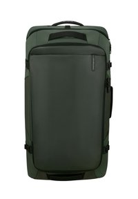 Green fabric suitcase with a rectangular shape, featuring a front zipper pocket, top handle, and side compression straps for secure closure.