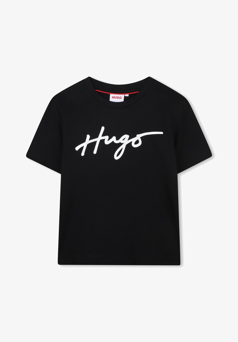 T-shirt en coton noir avec un logo « Hugo » en cursive blanche sur le devant. Manches courtes et col rond. Texture lisse.
