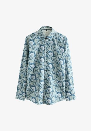 Blomstret skjorte med knapper, der har en blå baggrund med hvide og grønne blomster mønstre. Fremstillet af glat stof med lange ærmer.
