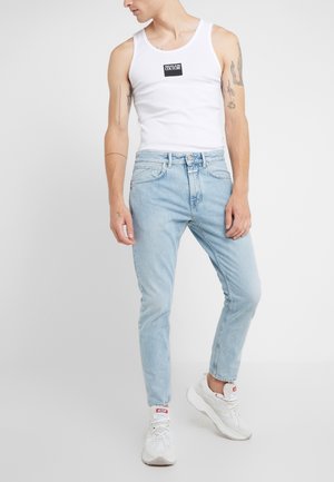 Jeans Tapered Fit - light-blue denim